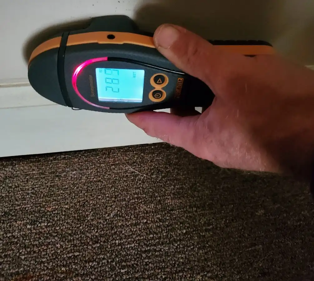 Moisture detection at baseboard during Storm Damage Restoration in Albertville